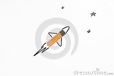 Alkaline battery is like a rocket flying into space. Powerful battery creative concept. White background, flat lay Stock Photo