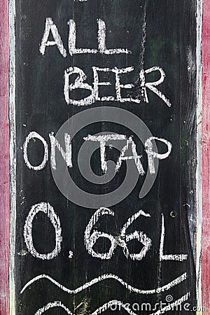 All beer on tap the inscription is chalked on a black board of a Stock Photo