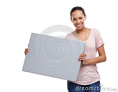 All contained on one little board. Portrait of an attractive young woman in a studio holding a board isolated on white. Stock Photo