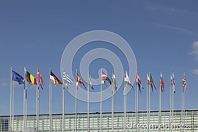 All EU Flags European Union flag waving in front of European Parliament, headquarter of the European Commission European Editorial Stock Photo
