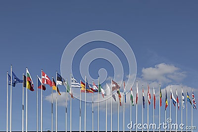 All EU Flags European Union flag waving in front of European Parliament, headquarter of the European Commission European Editorial Stock Photo