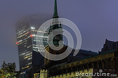 All Hallows by the Tower an ancient Anglican church on Byward Street in the City of London at night Stock Photo