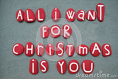 All I want for Christmas is you, creative message composed with red colored stone letters Stock Photo