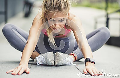 The all-important pre-workout stretch. Stock Photo