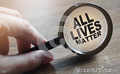 ALL LIVES MATTER. Anti racism concept. Inscription under magnifyer on table. Editorial Stock Photo