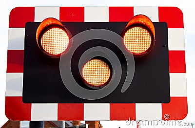 All three light on the level crossing signal lights Stock Photo