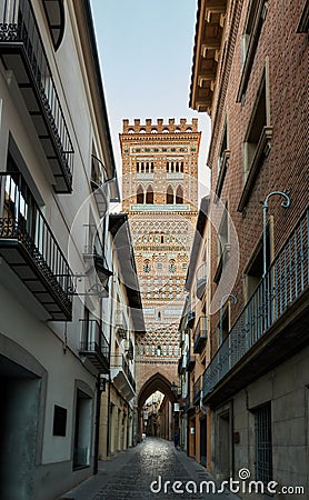 Alley with an Arab tower surrounded by houses Stock Photo