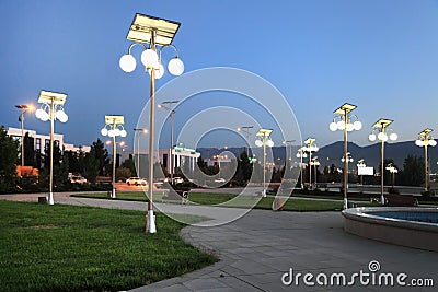 Alley in the park with a solar-powered lanterns. Stock Photo