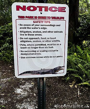 Alligator Public Park Metal Sign Notice Red and White Stock Photo