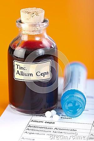 Allium Cepa plant extract and homeopathic pills Stock Photo