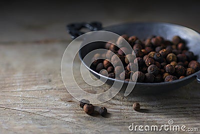 Allspice or english pepper, whole dried berries in a metal bowl Stock Photo