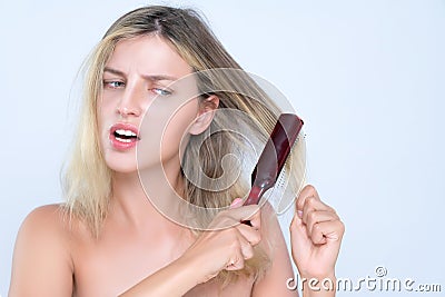 Alluring portrait of woman with cosmetic skin having hair problem. Stock Photo