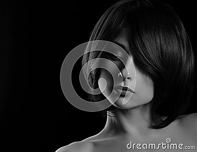 Alluring portrait of short bob hair style woman looking down on black background. Closeup art portrait Stock Photo