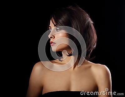 Alluring portrait of short bob hair style woman looking down on black background. Closeup portrait Stock Photo