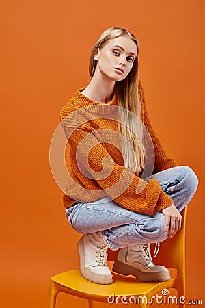 alluring woman in bright cozy sweater Stock Photo