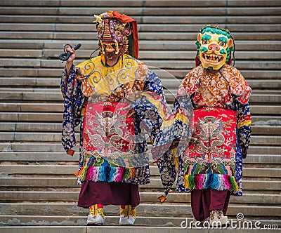 Almaty Buddha Temple monks deity mask monster feast Editorial Stock Photo