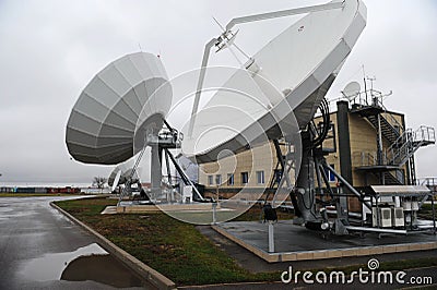 Almaty, Kazakhstan - 11.20.2015 : Parabolic industrial antennas and the territory of the KAZSAT satellite control center Editorial Stock Photo