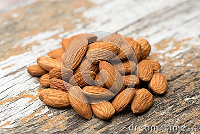 Almond dried fruits on an old wooden background Stock Photo