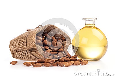 Almond dried seeds and oil isolated on white background Stock Photo