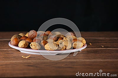 Almond and Hazelnut with shell in pink dish tablet wood Stock Photo