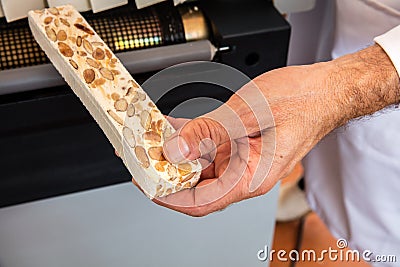 Almond and honey nougat portion freshly packed in cellophane Stock Photo