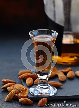 Almond liquor amaretto with whole nuts Stock Photo