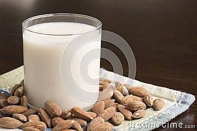 Almond Milk with almonds on table Stock Photo