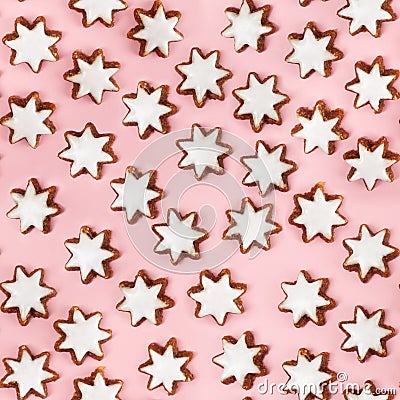 Almond stars biscuits with sugar icing on pink background. Stock Photo