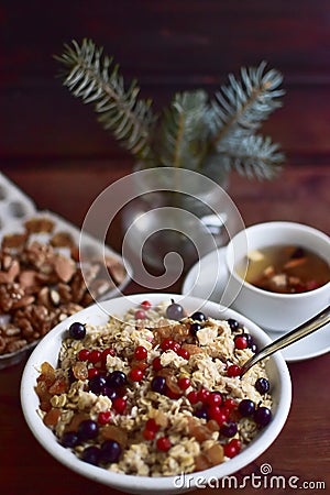 Almonds, porridge oat-flakes, porridge a breakfast, a healthy breakfast, porridge with prunes, porridge with berries, porr Stock Photo