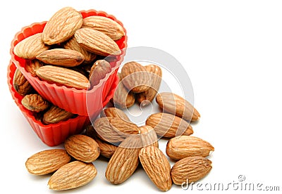 Several raw almonds white background surrounded Stock Photo