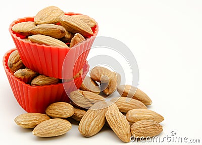 Several raw almonds white background surrounded Stock Photo