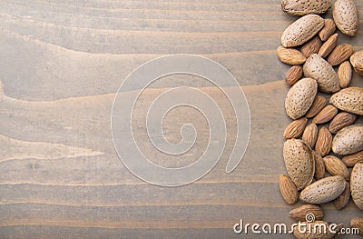 Almonds on wooden background Stock Photo