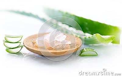 Aloe Vera gel closeup. Sliced aloevera leaf and gel, natural organic cosmetic ingredients for sensitive skin, alternative medicine Stock Photo