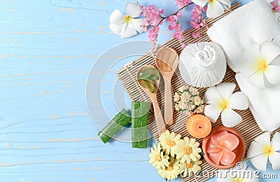 Aloe vera and Herbal Compress on blue wood Stock Photo