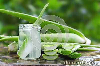 aloe vera juice in glass on stone Stock Photo