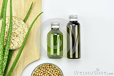 Aloe vera plant, Natural skincare beauty product .Cosmetic bottle containers with green herbal leaves. Stock Photo