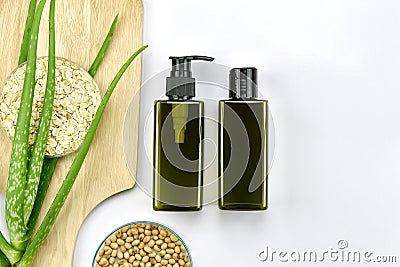 Aloe vera plant, Natural skincare beauty product, Cosmetic bottle containers with green herbal leaves. Stock Photo