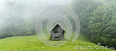 Alone cabin in the woods Stock Photo