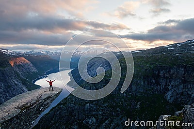 Alone tourist on Trolltunga rock Stock Photo