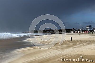 Alone in a windy beach taking a picture Stock Photo