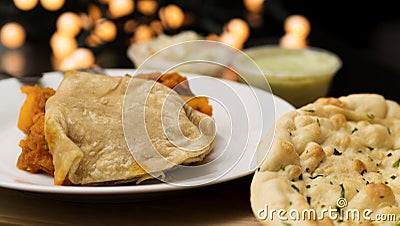 Aloo chaat with naan bread Stock Photo