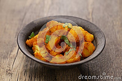 aloo gobi ki sabzi, Indian-style cooked potato and cauliflower. Stock Photo