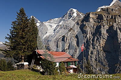 Alp with farm house Stock Photo