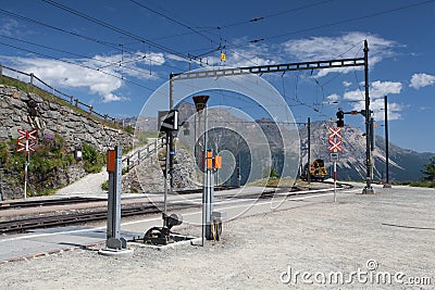 Alp Grum railway station is situated on the Bernina Railway, Switzerland Editorial Stock Photo