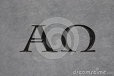 Alpha and Omega in stone Stock Photo