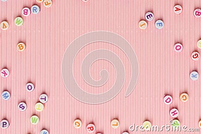 Alphabet beads border pink wallpaper background text space Stock Photo