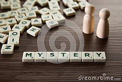 Alphabet block with Mystery word wooden table Stock Photo