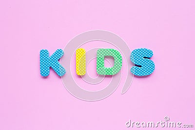 Alphabet `KIDS` on pink background. Stock Photo