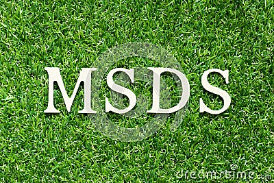 Alphabet in word MSDS Abbreviation of material safety data sheet on green grass background Stock Photo