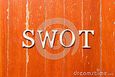 Alphabet in word swot abbreviation of strength, weakness, opportunities, threats on old red color wood plate background Stock Photo